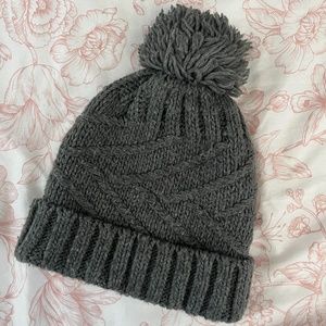grey beanie with fluffy pom pom